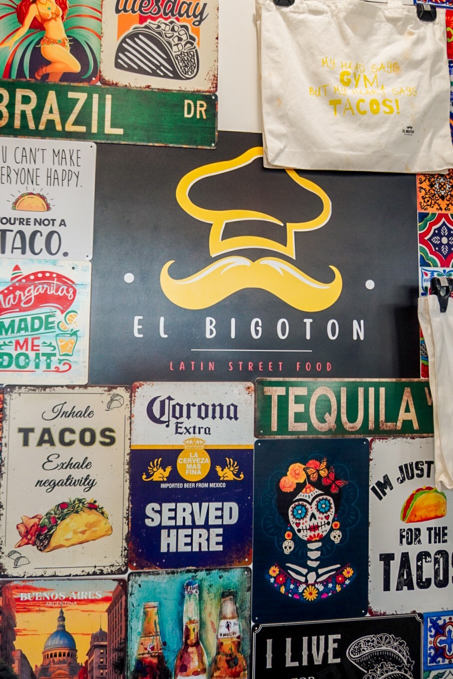 El Bigoton brand wall with colourful Latin-inspired signs and artwork