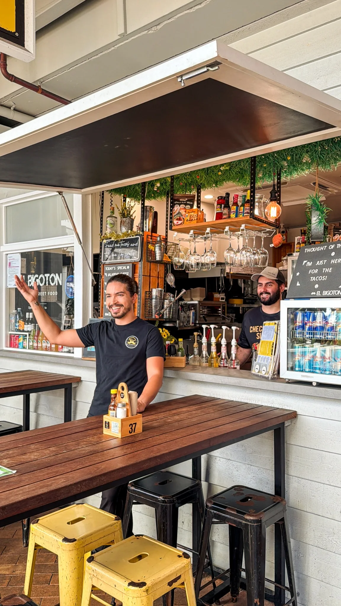 El Bigoton team welcoming guests at the restaurant counter